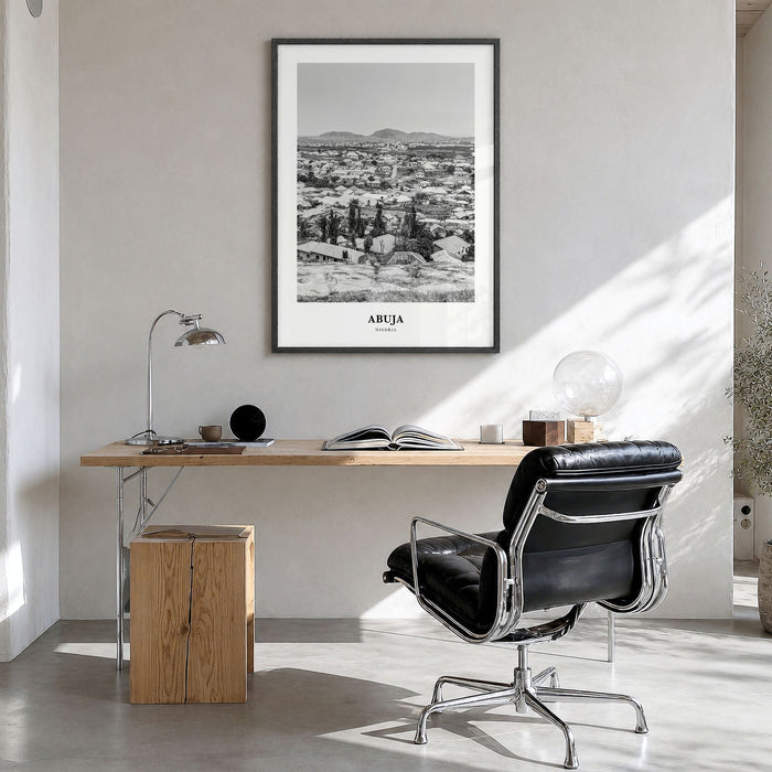 Abuja Classic Poster in a black wood frame, hanging in a bright home office