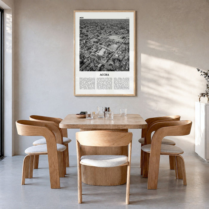 Accra Newspaper Poster in a natural wood frame, hanging in a dining room