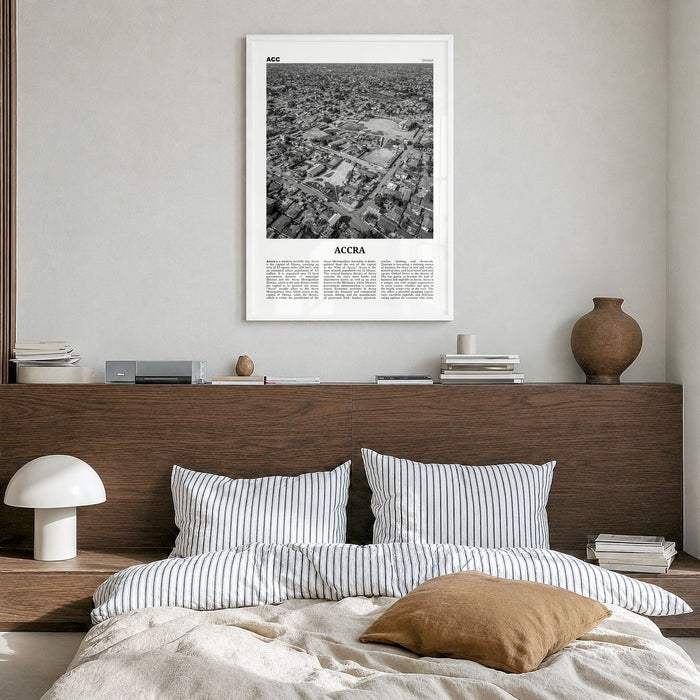 Accra Newspaper Poster in a white wood frame, hanging in a bedroom