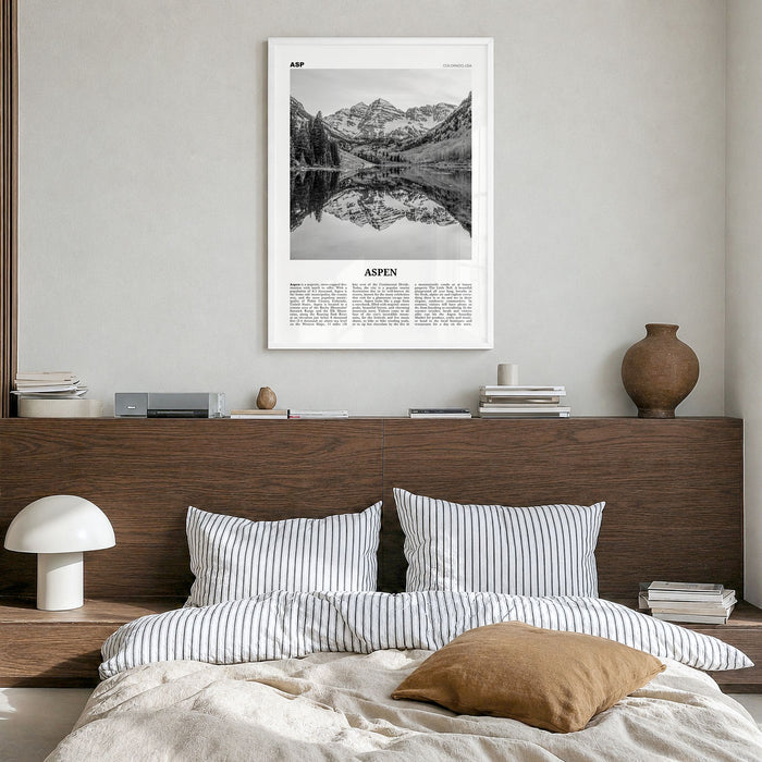 Aspen Newspaper Poster in a white wood frame, hanging in a bedroom