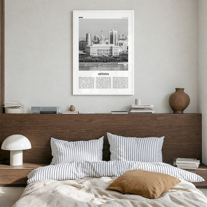 Astana Newspaper Poster in a white wood frame, hanging in a bedroom
