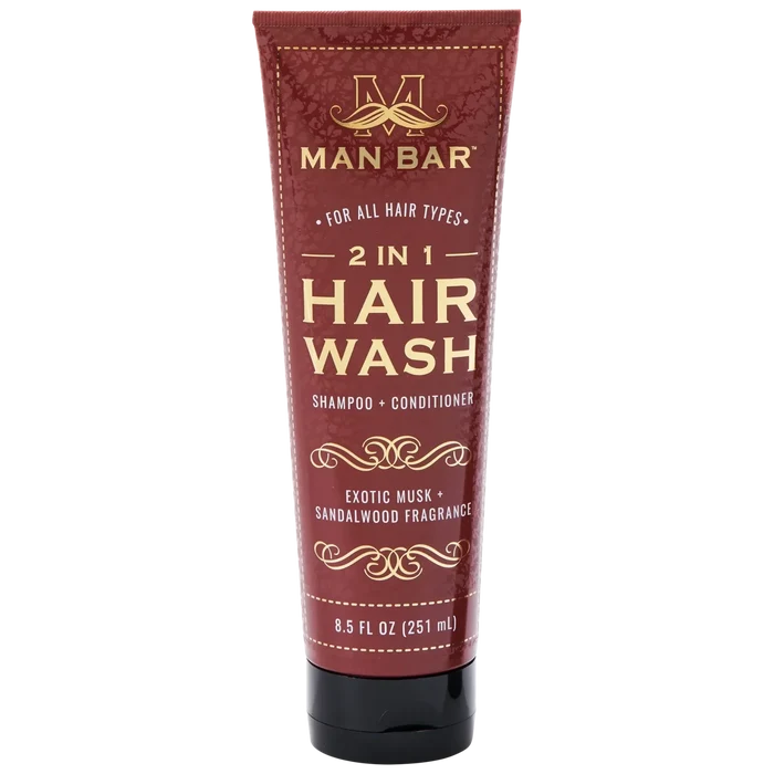 2-in-1 Exotic Musk & Sandalwood Hair Wash in black bottle with white label, moisturizing shampoo and conditioner.